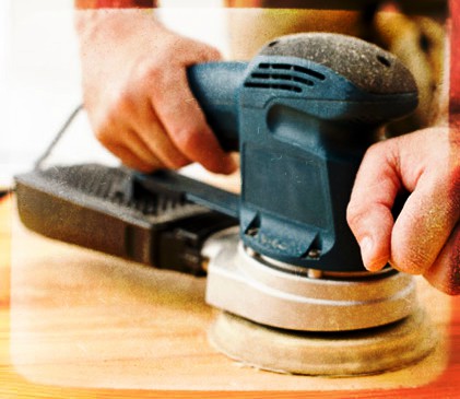 Sanding the hardwood floor before finishing